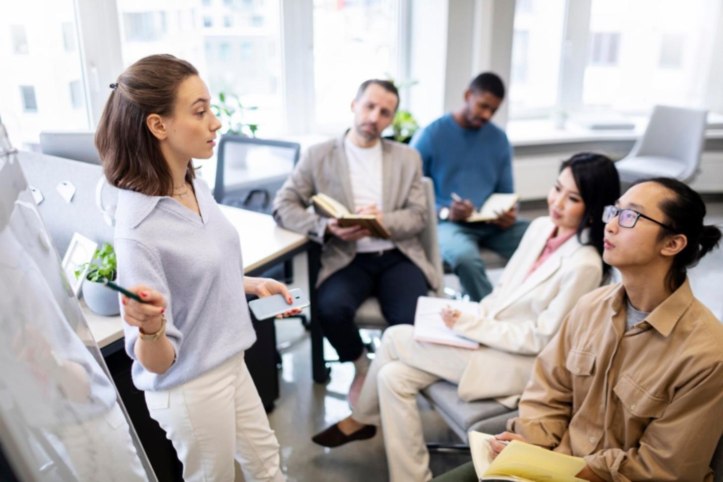 Business coaching session with professionals reviewing strategic plans